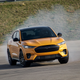 Pictured: a Mustang Mach-E, dodging a moose